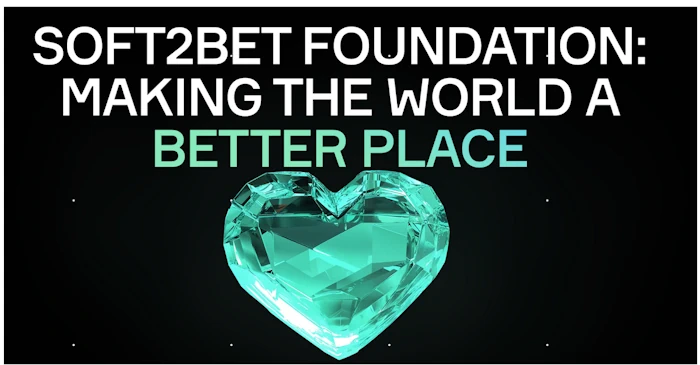 Soft2Bet Foundation banner with crystal heart and slogan 'Making the World a Better Place'